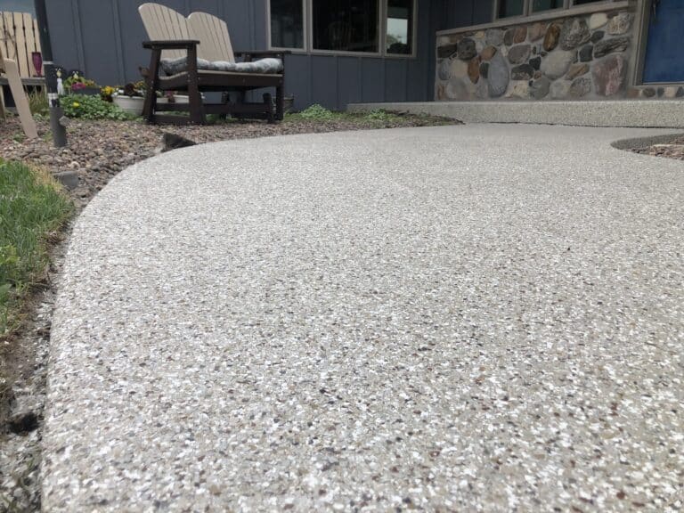 Fortress Floor Coatings of New Jersey transforms concrete pathways like the one pictured (a patio area outside a home)